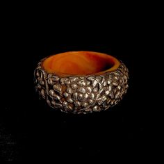 A one of a kind copal (new amber, made from natural tree resins) bracelet with silver hand carved floral designs. A traditional style bought directly from Tibetan artisans in Kathmandu Diameter  2.95"   Height 1.65" Traditional Amber Jewelry With Carved Details, Handmade Bakelite Bracelets As Gift, Brown Carved Bangle Jewelry, Brown Carved Bracelet Jewelry, Carved Brown Bangle Jewelry, Natural Tree, Resin Bracelet, Floral Bracelet, Floral Designs