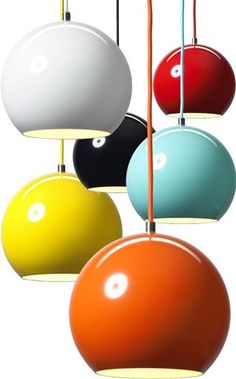 several different colored lamps hanging from the ceiling