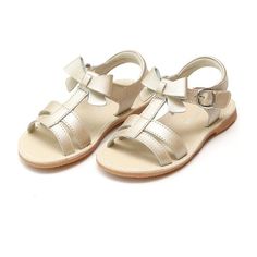 Janie is reminiscent of fragrant spring blossoms, and with its cute bow detail, your girls can proceed with absolute confidence. Perfect as a vacation sandal or dressy sandal for special occasions. | L'Amour - Janie T-Strap Bow Sandal, Champagne (Tan, Size 7)  |  Maisonette collects the best children’s products from around the world (unlike Zulily, Etsy, The Tot, Farfetch Kids, Childrensalon, Crate and Kids, Kohls, Wayfair, Buy Buy Baby, Nordstroms, Mini Boden, J.Crew Factory, or PotteryBarn Kid Vacation Sandals, Pearl Sandals, Spring Blossoms, Dressy Sandals, Bow Sandals, Boy Accessories, Light Weight Shoes, Heritage Fashion, Shop Shoes