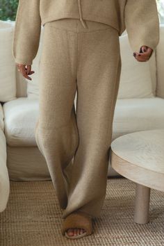 These Autumn Wave knit sweater pants are made with a soft camel knit fabric for a cozy and stylish look. Perfect for cooler weather, these pants offer a warm and comfortable fit. With a relaxed silhouette and classic design, these pants are a must-have for any fall wardrobe. Mini Jumpsuit, Strapless Tops, Cooler Weather, Sweater Sale, Sweater Pants, Party Looks, Sweater Blouse, Fall Wardrobe, Signature Style