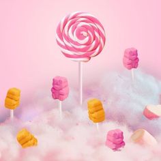 pink and yellow lollipops are in the clouds