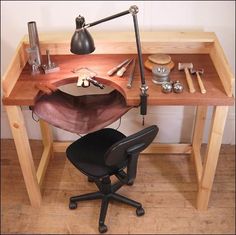 an office chair sitting next to a wooden desk