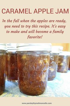 some jars filled with food sitting on top of a table next to a sign that says caramel apple jam