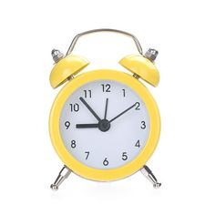 a yellow alarm clock on a white background