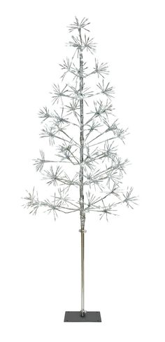 a small white christmas tree on a metal stand