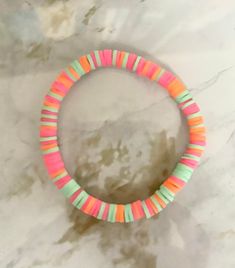 This bracelet is perfect for any colorful outfit. It is super cute! In the bracelet the colors inclue pink, orange, and light blue!🧡💙 Fun Multicolor Beaded Bracelets For Spring, Multicolor Friendship Bracelets For Spring Vacation, Fun Pink Stretch Bracelet With Colorful Beads, Multicolor Playful Bracelets For Spring, Fun Multicolor Stretch Bracelet For Beach, Fun Colorful Stretch Bracelet For Beach, Handmade Multicolor Bracelets For Spring, Colorful Fun Stretch Bracelet For Beach, Playful Multicolor Bracelets For Spring