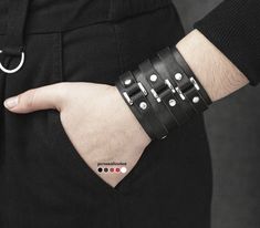 "⚡️ more wide bracelets ➡️ https://www.etsy.com/shop/LL910?ref=seller-platform-mcnav&section_id=24058852 🔥 buy 2 - free shipping 🔥 buy 3 - save  The black leather wide cuff bracelet with three buckles is on trend today. Our men wristband or women wrap bangle adding and completing any image in fashion outlook. This punk rock bracelet in Johnny Depp style is a perfect birthday gift for your boyfriend or girlfriend. The steampunk bracelet in minimal style is stylish and fancy. Such unisex bracelet got the second birth and became relevant, like never before.   Width: 2.3 inch (6 cm) WRIST size:  from 4.7 to 5.5 inch  (12-14 cm) from 5.5 to 6.1 inch  (14-15,5 cm) from 5.9 to 6.7 inch  (15-17 cm) from 6.3 to 7.0 inch  (16-18 cm) from 7.5 to 8.3 inch  (19-21 cm) from 8.6 to 9.4 inch (22-24 cm) Punk Style Leather Cuff Bracelet, Black Punk Cuff Bracelet, Edgy Black Cuff Bracelet For Concerts, Leather Braces, Johnny Depp Style, Leather Wrist Cuff, Steampunk Bracelet, Wrap Bangles, Large Bracelet