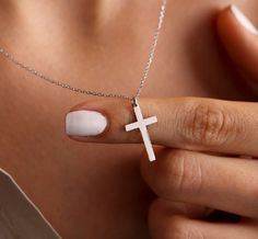 Experience the timeless beauty of our Cross Silver pendant necklace. Crafted with sterling silver, this 18 inch necklace boasts a stunning cross pendant that adds a touch of elegance to any outfit. A perfect addition to your jewelry collection! Minimalist Sterling Silver Cross Necklace With Clavicle Chain, White Sterling Silver Cross Jewelry, White Cross Pendant Necklace With Clavicle Chain, White Cross Necklace With Clavicle Chain, Minimalist Sterling Silver Cross Pendant Necklace, Gift Cross Pendant Necklace With Clavicle Chain, Elegant Sterling Silver Crucifix Necklace, Crucifix Cross Necklace With Clavicle Chain As Gift, Gift Cross Necklace With Clavicle Chain