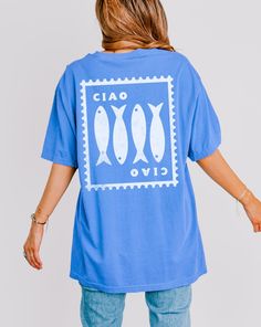 Get ready to be OBSESSED with your Ciao Ciao Sardine T-Shirt! This shirt is the cutest and most trendy way to emit all those coastal granddaughter vibes! This is the perfect soft tee to throw on for a Sunday stroll on the boardwalk! Also makes a great gift! This design is an original, created by Jackie Bonsignore @ Drift East Designs. She uses digital design elements and collage. She optimizes each image or illustration for a crisp, clear and gorgeous print onto a variety of apparel.  * Q U I C K * F A C T S * ✺ This is a Comfort Colors T-shirt, known for exceptional construction, softness, and durability, using only high-quality, USA-grown ring-spun cotton. ✺ 100% preshrunk cotton (fiber content may vary for different colors) ✺ Wash and dry normally (on cool for best results) ✺ Please not Blue Fish Print Top For Summer, Blue Short Sleeve Top With Fish Print, Casual Blue Tops With Fish Print, Cotton Short Sleeve T-shirt With Fish Print, Cotton Short Sleeve Top With Fish Print, Summer Fish Print Crew Neck Tops, Summer Crew Neck Top With Fish Print, Short Sleeve Graphic Tee With Fish Print, Short Sleeve Cotton Shirt With Fish Print