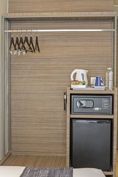 a microwave oven sitting next to a dryer in a room