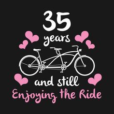 a bicycle with hearts on it and the words 35 years and still enjoying the ride