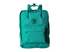 Fjallraven Re-Kanken - Bags : Emerald : The primary materials that compose this product contain a minimum of 20 percent recycled content. Constructed from 11 recycled plastic bottles, Fjällräven focuses on the environment with the Re-Kånken backpack. The Fjällräven SPIN DYE process reduces water consumption and minimizes impact. Large main compartment to hold all your daily essentials. Front zip pocket for additional storage. Side slip pocket for water bottle. Dual top handles with snap closure Re Kanken, Water Consumption, Daily Essentials, Kanken Backpack, Recycle Plastic Bottles, Fjallraven Kanken Backpack, Free Clothes, Recycled Plastic, Plastic Bottles