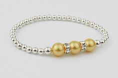 Pearls of Hope Bracelet - This gorgeous, eye-catching bracelet is a Choose Hope favorite! &nbsp;Aptly named Pearls of Hope, it features silver plated beads with three stunning. Elegant Yellow Adjustable Beaded Bracelets, Elegant Yellow Stretch Bracelet With Round Beads, Elegant Adjustable Yellow Crystal Bracelet, Elegant Yellow Beaded Stretch Bracelet, Elegant Yellow Stretch Bracelet, Hope Bracelet, Choose Hope, Silver Plate, Plating