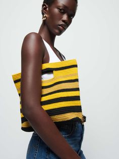 It's the bold crochet bag you'll reach for when you wanna add a little drama to your day (the good kind). Hold it by the handle or fold it over casually like a clutch, and just walk away. (This one comes in Sulphur Stripe.) Measurements:- Bag Height = 11"- Base Length = 12 3/4"- Base Width = 2" | Seaside Bag in Sulphur Stripe | Ethical Essentials Yellow Woven Top Handle Shoulder Bag, Chic Yellow Crochet Bag For Daily Use, Chic Yellow Crochet Bag, Summer Yellow Shoulder Bag With Top Handle, Yellow Crochet Bag For Spring, Spring Yellow Crochet Bag, Yellow Handwoven Shoulder Bag For Shopping, Yellow Top Handle Straw Bag For Shopping, Yellow Crochet Tote Bag For Spring