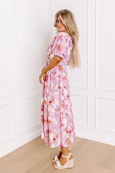 - Your heart will melt for this gorgeous midi! Its flowy design and beautiful watercolor print makes it a perfect addition to any stylish girlie's wardrobe. Make an enchanting impression wherever your path leads you in this darling dress! - Fully lined material with a blush, ivory, and copper colored watercolor print - An elastic v-cut neckline - Short draped sleeves - An elastic waistline - Functional side pockets - A flowy silhouette that ends in a midi length hemline Measurements S : Bust 38" Pink Flowy Modest Maxi Dress, Pink Flowy Maxi Dress With Midi Length, Pink Flowy Midi Maxi Dress, Pink Flowy Midi Length Maxi Dress, Modest Pink Midi Dress For Garden Party, Flowy Multicolor Midi Floral Dress, Flowy Multicolor Floral Midi Dress, Pink Short Sleeve Dress With Abstract Print, Spring Tie Dye Flowy Maxi Dress