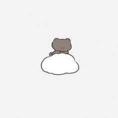 a teddy bear sitting on top of a cloud