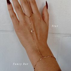 The Slayer Girl Hand Chain is the perfect customized hand chain that gives off the ultimate sparkle. Add a charm to your hand chain to create a piece that is custom made for YOU just like you're in our store in Scottsdale, AZ! Product Details: Made to Order - FINAL SALE 14K Gold-Filled Starburst, Rope or Fancy Bar chain Gothic Initials, Birthstones, CZ Star, Flower & Roman Cross Charms Available 6", 7", 8" Wrist Sizes Available 3" Ring Circumference with 3.5" Connecting Chain Water-Wearable Made Fancy Bar, Hand Chain Jewelry, Finger Bracelets, Gold Bracelet Simple, Hand Chain Bracelet, Diamond Girl, Girl Hand, Wrist Jewelry, Dope Jewelry