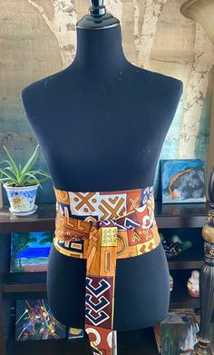 "Long African print belt in vibrant colors. This Ankara belt will be specially handcrafted for you upon purchase. The fabric is high-quality African print, 100% cotton. Choose from a variety of colorful prints. These are creative ways to add a pop of color to your wardrobe and enhance your style! Our gorgeous waist sash is double-sided and reversible. Can also be made in 2 different colors for double the fun - just let us know! This Obi belt allows for a variety of ways to wear: Rock this sash w Handmade Multicolor Belts For Festival, Handmade Multicolor Belt For Festivals, Adjustable Artisan Multicolor Belt, Artisan Multicolor Fabric Belt, Adjustable Handmade Multicolor Belt, Ankara Belt, African Skirts, Waist Sash, Beautiful Belts