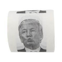 a black and white photo of a man in a tuxedo on a roll of toilet paper