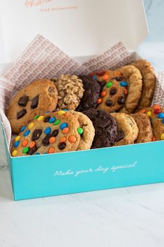 a blue box filled with lots of cookies