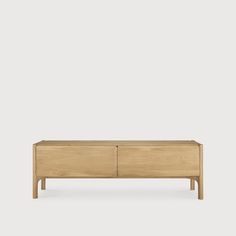 the sideboard is made from wood and has two drawers, one with an open drawer