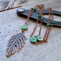 I love the rich, warm colors of these turquoise beads. The turquoise combined with the brown tones gives this series a very warm, rustic look. Long necklaces can go with so many varieties of outfits. Pair this up with a casual shirt or dress it up with your favorite sweater. Sure to become a timeless treasure. These leaves are currently available with the copper (shown on this necklace) and antique brass. They are a double sided 23 x 45mm. The small bead is a 3 x 5mm teal bead. The flower bead i Adjustable Green Rustic Necklace, Adjustable Rustic Green Necklace, Bohemian Brown Turquoise Necklace For Jewelry Making, Earthy Turquoise Necklaces For Jewelry Making, Earthy Turquoise Beaded Necklaces, Rustic Beaded Necklaces For Gifts, Bohemian Brown Jewelry With Patina, Bohemian Rust Necklaces For Gift, Bohemian Copper Necklace With Patina