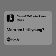 an iphone screen with the text mom am i still young? and spotify on it