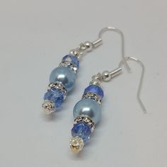 "Blue Pearl Drop Earrings, Wedding Earrings Fashion earrings made with flair and finesse. They are very lightweight, hypoallergenic, and catch the eye easily. The photos just do not do them justice! They measure 1 1/2\" inches from the top of the hook to the bottom metal dangle bead. Get something blue for your wedding jewelry in these authentic look blue pearl earrings that are simply elegant. They make unique gifts for any occasion and are perfect Mothers Day Jewelry as well. So whether you ar Classic Blue Pearl Earrings For Wedding, Blue Hypoallergenic Earrings For Formal Occasions, Hypoallergenic Blue Jewelry For Wedding, Hypoallergenic Blue Wedding Jewelry, Classic Blue Pearl Earrings For Anniversary, Elegant Hypoallergenic Adjustable Crystal Earrings, Nickel-free Blue Earrings For Wedding, Blue Pierced Earrings For Wedding, Pearl Drop Earrings Wedding