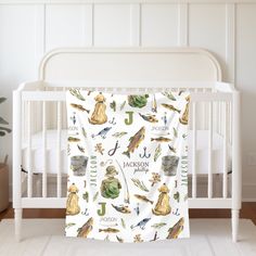 a baby crib with a personalized blanket in the shape of animals and letters