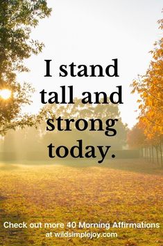 the words i stand tall and strong in front of an image of trees with yellow leaves