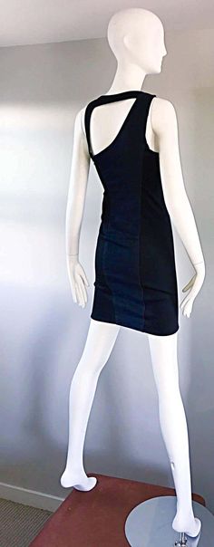 For Sale on 1stDibs - Sexy and rare 90s HELMUT LANG dark blue jean and black bodcon asymmetrical mini dress! Features a denim front, with a black stretchy back. Asymmetrical Fitted Denim Mini Dress For Club, Fitted Denim Bodycon Dress, Chic Fitted Bodycon Dress, Black Fitted Cotton Bodycon Dress, Fitted Black Cotton Bodycon Dress, Fitted Cotton Evening Mini Dress, Fitted Cotton Mini Dress For Evening, Black Denim Mini Dress For Night Out, Indigo Denim