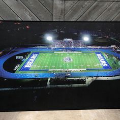 an aerial view of a football field at night