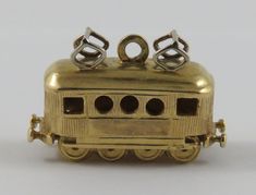 "This is a vintage \"Tram/Streetcar\" 18 karat gold charm for a charm bracelet.  It weighs 7.65 grams and measures 1\" x 5/8\", marked \"18K\" All charms come with a split ring to attach to a bracelet. We have hundreds of charms in stock. If you don't see what you are looking for in our shop please contact us as it is likely we have it. Inventory #G2885" Karat Sizes, Diamond Carat Size, Shiny Bracelets, Charm Accessories, Diamond Bracelet Design, Jewelry Staples, Classic Bracelets, Cable Car, Gold Charms