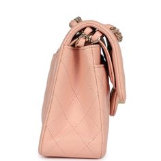 This Small Classic Double Flap bag is in light pink lambskin leather with gold tone hardware and features a front flap with signature CC turnlock closure, half moon back pocket, and adjustable interwoven gold tone chain link and light pink leather shoulder strap.The interior is lined in light pink leather with the "love letter" zipper compartment underneath the first flap, an "outer" slit pocket under the second flap, and an interior compartment with two open pockets separated by a "lipstick" compartment.Collection: 31-Series (2021)Origin: FranceCondition: Pre-owned; Excellent to Mint - This bag retains its shape structure. No visible signs of scratching to the hardware. The exterior leather has some minor signs of wear around the corners, and to the back exterior pocket. There is a small Love Letter, Flap Bag, Pink Leather, Lambskin Leather, Half Moon, Chain Link, Gold Hardware, Light Pink, Gold Tones