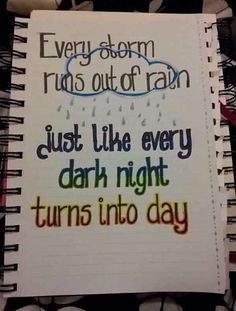 an open notebook with the words, every storm rains out of rain just like every dark night turns into day