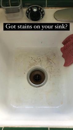 a sink that has been cleaned and is sitting on the counter with a red mitt next to it