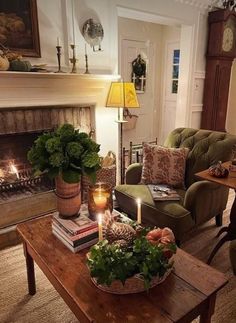 a living room filled with furniture and a fire place next to a fireplace covered in candles