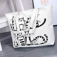 cat-tote-bag Travel Shoulder Bag With Cat Print, Trendy Cat Print Shoulder Bag For Everyday Use, Casual Canvas Bag With Cat Design For Travel, White Cat Print Bag For Everyday Use, Cat Print Shoulder Travel Bag, Trendy Cat Print Travel Bag, Trendy Travel Bags With Cat Print, Daily Use Cat Print Canvas Tote Bag, White Canvas Bag With Cat Design For Daily Use