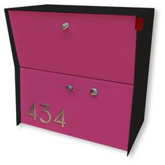 a pink and black mailbox with the number 434 on it