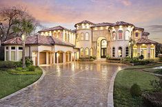 a large house that is in the middle of a driveway