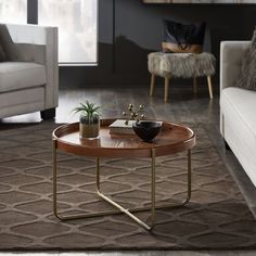 a living room with a couch, chair and coffee table