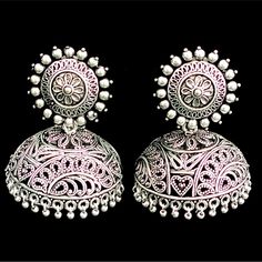 Add some zest to your look in this pair of tribal earrings! Vintage style earrings with intricate details. Approximate earrings length is 2.5 inch long Designed over brass with silver oxidized finish. Ornate Jhumkas For Festivals With Pierced Ears, Ornate Jhumkas For Pierced Ears, Ornate Oxidized Finish Earrings For Festive Occasions, Heavy Ornate Jhumkas, Ornate Chandbali Oxidized Jhumkas, Ornate Chandbali Jhumkas With Oxidized Finish, Ornate Oxidized Chandbali Jhumkas, Festive Bohemian Jhumkas, Bohemian Metal Jhumkas With Intricate Design