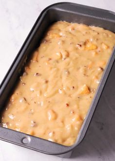 a pan filled with food sitting on top of a counter