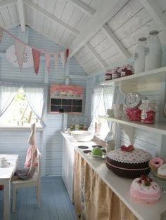 a kitchen filled with lots of cakes and cupcakes