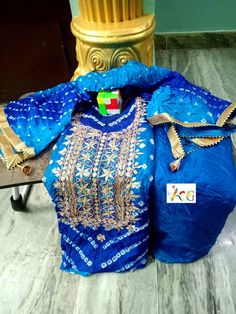 Thank you very much for visiting my shop. New Launched heavy suits pcs Bandhej silk suits with heavy hand goota Patti nd Kundan work with gotta bijjya border on duppta with same fabric silk bottom  Note: Duppta also with gotta Patti work 03 pcs suits Kurta 2.5 mitrs Duppta 2.5 mitrs Bottom 2.5 mitrs Easy to wear and very comfortable                                                    FREE STITCHING OFFER It Gracefully Add Style To Your Attire & Match With Your Confidence Disclaimer: Colors may slightly vary due to Photographic effects IMPORTANT NOTE : Please Be aware that Similar Looking Products of LOW QUALITY are Being Sold at Lower Price By Other Sellers, So Make Sure that You Order Genuine Products Sold By "VINTAGECRAFTGALLERY" Semi-stitched Raw Silk Set With Gota Work, Silk Bandhani Print Straight Kurta, Blue Silk Unstitched Suit For Navratri, Eid Special Katan Silk Sharara With Gota Work, Eid Katan Silk Sharara With Gota Work, Festive Designer Bandhani Salwar Kameez, Designer Blue Unstitched Suit With Gota Work, Blue Bandhani Chanderi Salwar Kameez, Bollywood Style Designer Bandhani Print Salwar Kameez