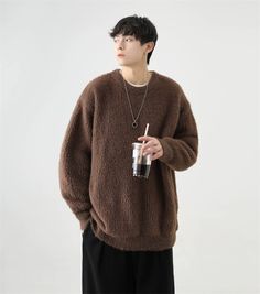 Wrap yourself in the comfort of our Fuzzy Crew Neck Oversized Knit Sweater, where coziness meets effortless style. Crafted with attention to detail, this sweatshirt features a soft acrylic construction, giving it a plush feel that's ideal for your off-duty days. The oversized fit lends a modern edge to the classic round neck design, while the solid coffee color makes it a versatile addition to any wardrobe. Pair this essential top with your favorite jeans for a casual day out or layer it over a Comfortable Crew Neck Sweater With Soft Texture, Casual Brown Acrylic Sweater, Cozy Fit Soft Knit Comfortable Sweater, Comfortable Fall Sweater With Soft Texture, Comfy Crew Neck Winter Sweater, Comfy Crew Neck Knit Sweater, Winter Soft Texture Relaxed Fit Sweatshirt, Comfy Winter Sweater With Soft Texture, Oversized Crew Neck Sweater With Soft Texture