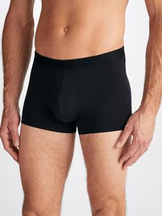 Our Alex boxer briefs in black are cut for a streamlined, classic look with a fitted shape, closed front and a shorter leg. A fabric-covered waistband provides gentle skin contact. Crafted from a lighter weight version of our best-selling Basel fabric, combining a blend of 94% micro modal and 6% elastane for exceptional softness and comfort. Not only is the Alex boxer brief soft, but thermostatic properties in the micro modal fibres allow them to react to changes in temperature and regulate your Black Seamless Short Length Boxer Briefs, Black Seamless Short Boxer Briefs, Black Fitted Seamless Boxer Briefs, Fitted Seamless Black Boxer Briefs, Black Compression Boxer Briefs Short Leg, Black Compression Boxer Briefs With Short Leg, Compressive Black Boxer Briefs With Built-in Shorts, Fitted Solid Color Boxer Briefs With Short Leg, Stretch Black Boxer Briefs