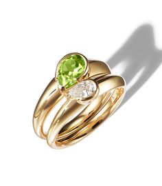 === Elevate your ring stacking game with the enchanting Duo Heart Stacking Ring. This unique piece features two separate bands, each adorned with its own captivating stone. One band showcases a large pear-shaped peridot, while the other gleams with a shimmering pear-shaped diamond. When stacked together, the bands intertwine to form a heart, symbolizing love and connection. Wear them as a heart for a romantic look or separate them to add a touch of color or sparkle to your ring-stacking looks. E Shape Of Love, Open Diamond Ring, Gold Stacking Ring, Pave Necklace, Diamond Stacks, Stephen Webster, Mini Necklace, Love Shape, Pave Diamond Ring