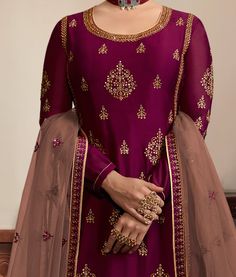 COLOR : Wine Purple & Taupe FABRIC : Top - Satin, Bottom - Net Lehenga & Santoon Pants, Dupatta - Net WORK : Heavy Resham & Zari Embroidery, Hand Work, Stones, Sequins, Motifs, Lace Border OCCASION : Wedding, Reception, Party Wear, Festival ADDITIONAL INFO : The outfit comes with complimentary santoon pants besides the lehenga. READY-TO-WEAR : No STITCHING : Available as semi-stitched fabric, can be stitched using standard size option (+$30). Note: There might be a slight color variation due to Embroidery Hand Work, Kurti Styles, Wedding Reception Party, Kurti Style, Wine Purple, Taupe Fabric, Embroidered Kurti, Zari Embroidery, Top Satin