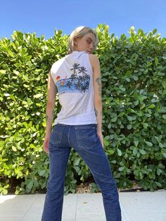 "late 1970's super soft Mazatlan tshirt with great boating print The denim also photographed can be found here: https://www.etsy.com/listing/1236100625/y2k-jeans-lei-y2k-denim-low-waist-dark?ref=listing_published_alert Bust: 35\" Length: 25\" Circa: 1970's Condition: Good vintage condition. Clean and ready to wear but has a few holes and spots. The sleeves were cut off. Super soft! Follow us on Instagram for the latest----> http://instagram.com/closetcasevintage @closetcasevintage Please contact 90s Cotton T-shirt For Beach, Retro Surfing T-shirt For Beach Season, Tropical T-shirt For Beach Season Surfing, Vacation Tshirt, Tropical Surfing T-shirt For Vacation, Mexican Beach, Y2k Denim, Palm Tree Beach, Vacation Tshirts